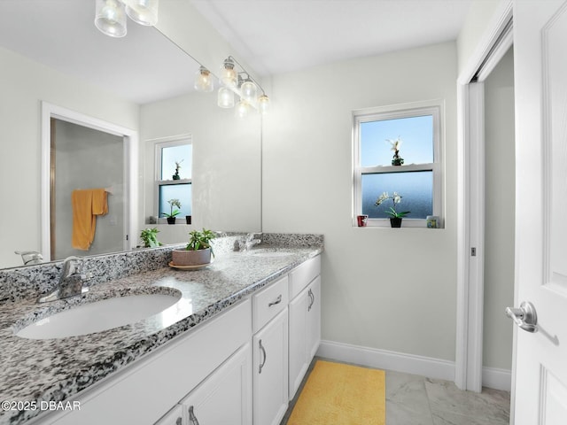 bathroom featuring vanity and a healthy amount of sunlight