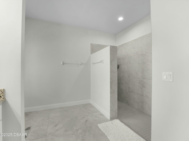 bathroom with a tile shower