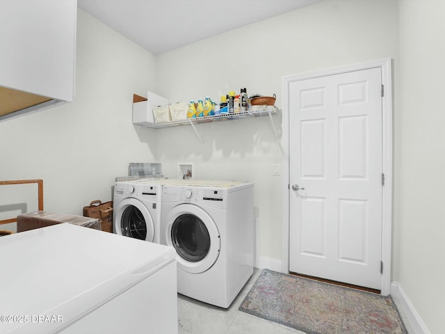 laundry room with separate washer and dryer