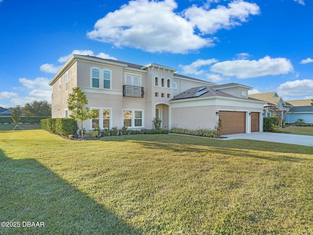 view of front of house with a garage and a front lawn