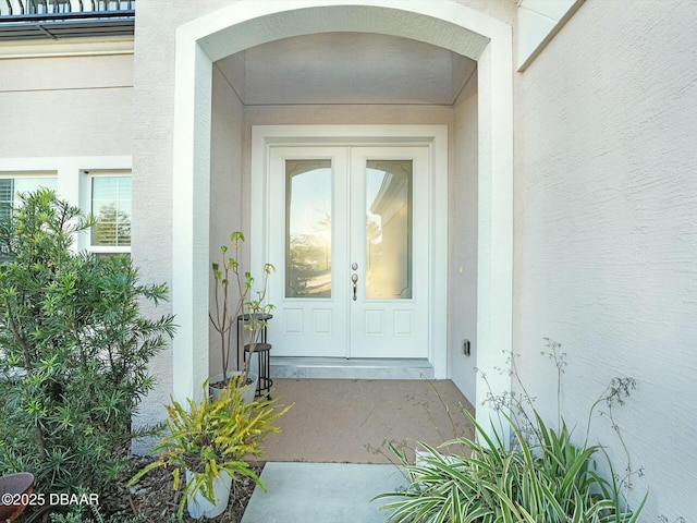 property entrance featuring french doors