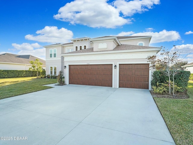 view of front of home with a garage and a front yard