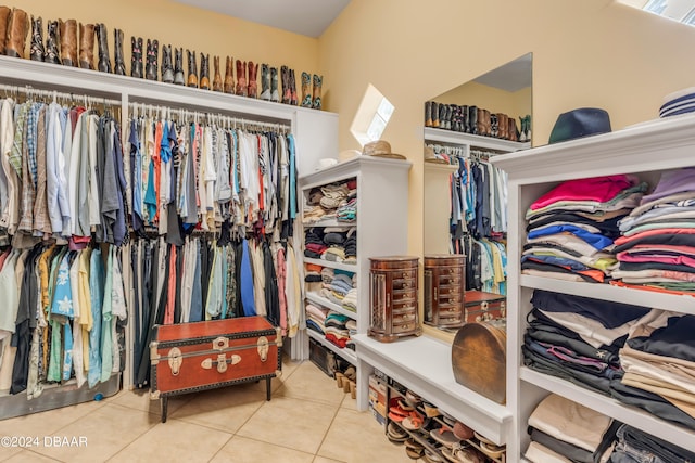 spacious closet with light tile patterned floors