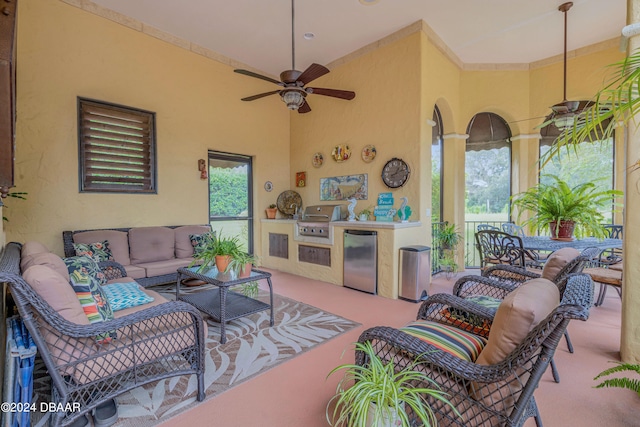 carpeted living room featuring ceiling fan