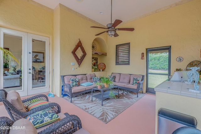 view of patio featuring french doors, ceiling fan, and an outdoor living space