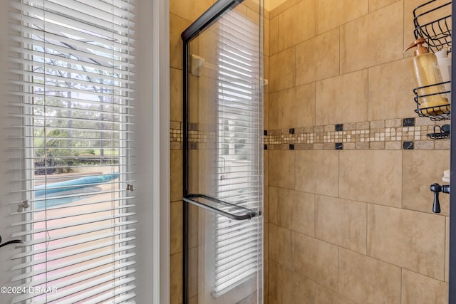 bathroom featuring an enclosed shower