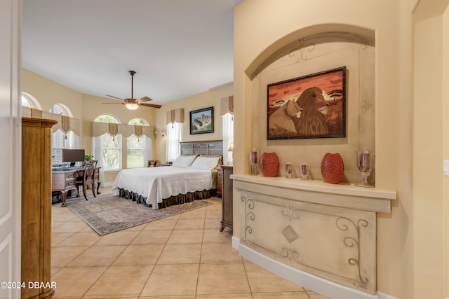 tiled bedroom with ceiling fan