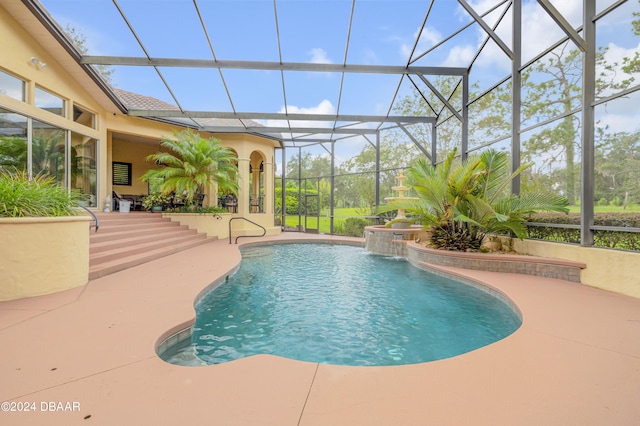 view of swimming pool featuring a patio, glass enclosure, and pool water feature