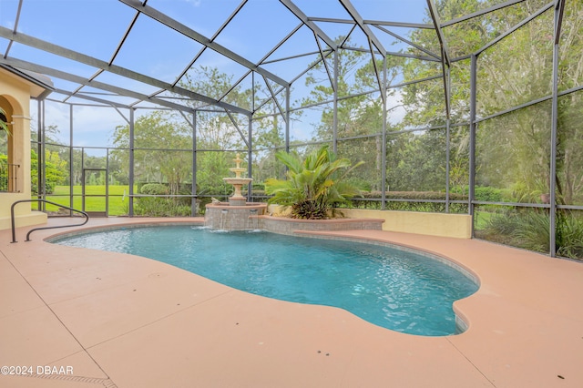 view of pool featuring a lanai, pool water feature, and a patio area