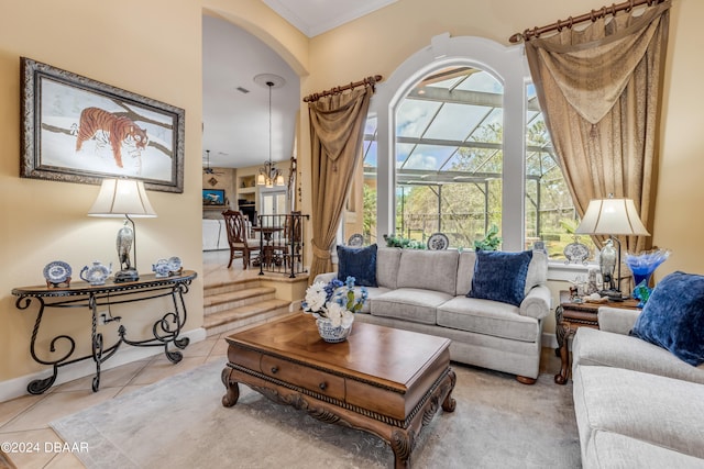 living room featuring light tile patterned floors and ornamental molding