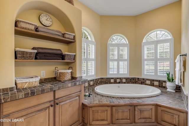 bathroom featuring a healthy amount of sunlight and a bathing tub