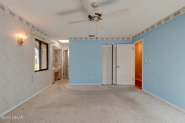 130 Kimberly Dr, Ormond Beach, FL 32174 - spare room featuring a ceiling fan, wallpapered walls, light carpet, and baseboards