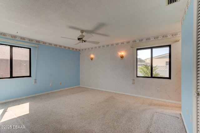 130 Kimberly Dr, Ormond Beach, FL 32174 - spare room with carpet, ceiling fan, a textured ceiling, and baseboards