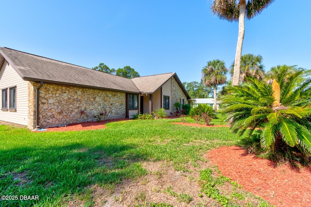 130 Kimberly Dr, Ormond Beach, FL 32174 - view of home's exterior with stone siding and a lawn