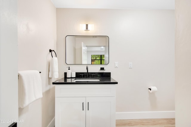 1512 Old Kings Rd, Daytona Beach, FL 32117 - bathroom featuring hardwood / wood-style floors and vanity