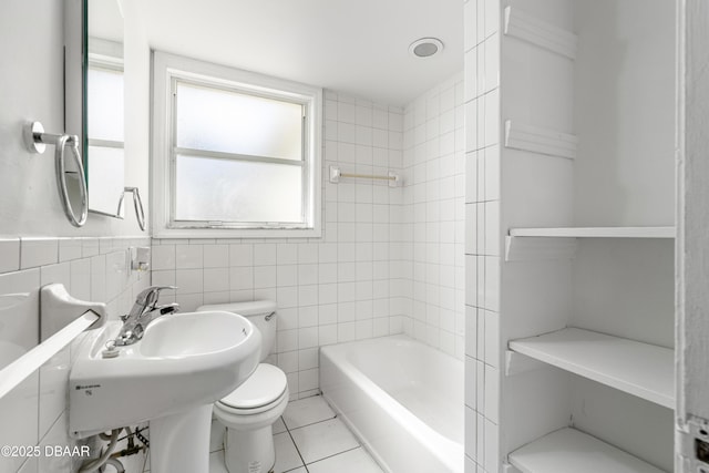 408 Frances Ter, Daytona Beach, FL 32118 - full bath with shower / washtub combination, a wainscoted wall, tile walls, toilet, and tile patterned flooring