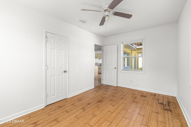 408 Frances Ter, Daytona Beach, FL 32118 - unfurnished bedroom featuring a ceiling fan, light wood-type flooring, visible vents, and baseboards