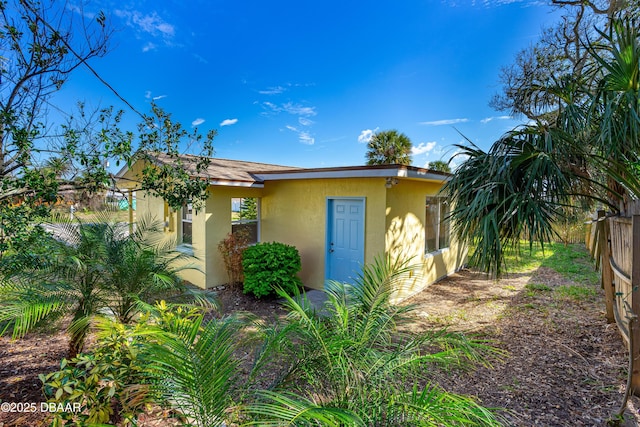 408 Frances Ter, Daytona Beach, FL 32118 - view of front of house with fence and stucco siding
