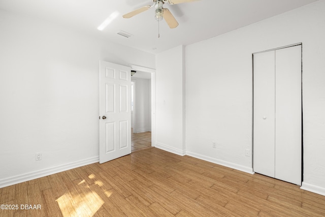 408 Frances Ter, Daytona Beach, FL 32118 - unfurnished bedroom featuring ceiling fan, visible vents, baseboards, a closet, and light wood finished floors