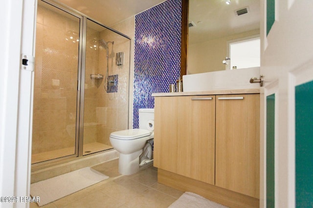 bathroom featuring walk in shower, tile patterned flooring, and toilet