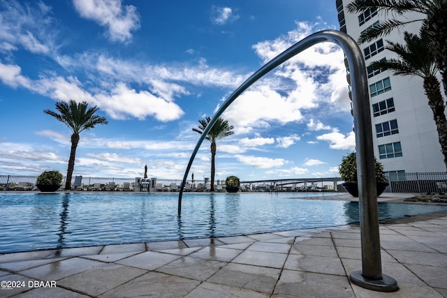 241 Riverside Dr Unit 402, Daytona Beach, FL 32117 - water view with a notable bridge and fence