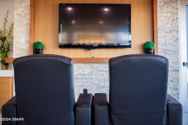 cinema featuring hardwood / wood-style floors and wood walls