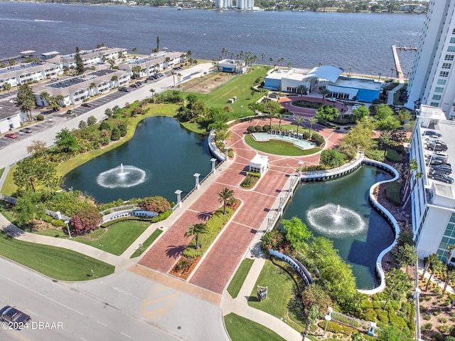 birds eye view of property with a water view