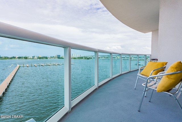 balcony featuring a water view