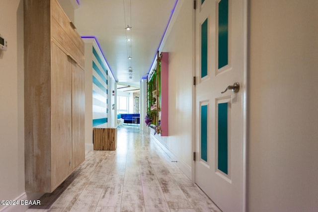 hallway with light wood-type flooring