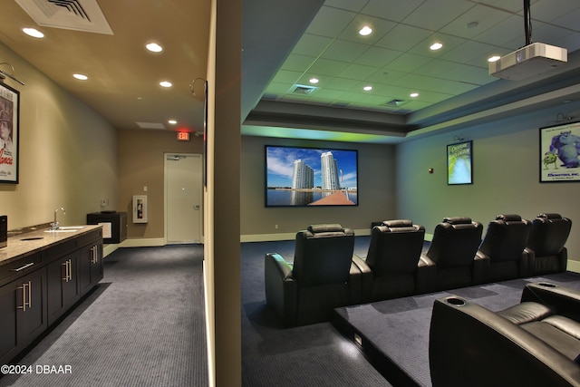 241 Riverside Dr Unit 402, Daytona Beach, FL 32117 - cinema with baseboards, dark carpet, a sink, recessed lighting, and a raised ceiling