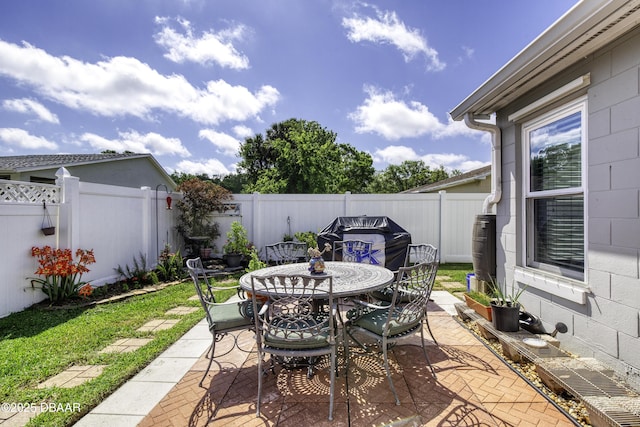 view of patio / terrace with outdoor dining area and a fenced backyard