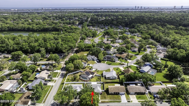 bird's eye view featuring a residential view, a water view, and a forest view