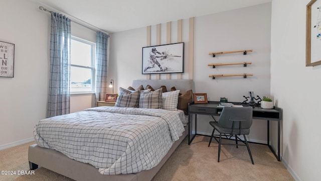 bedroom featuring light colored carpet