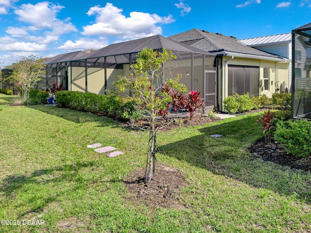 906 Coral Reef Way, Daytona Beach, FL 32124 - back of house with a lawn and a lanai