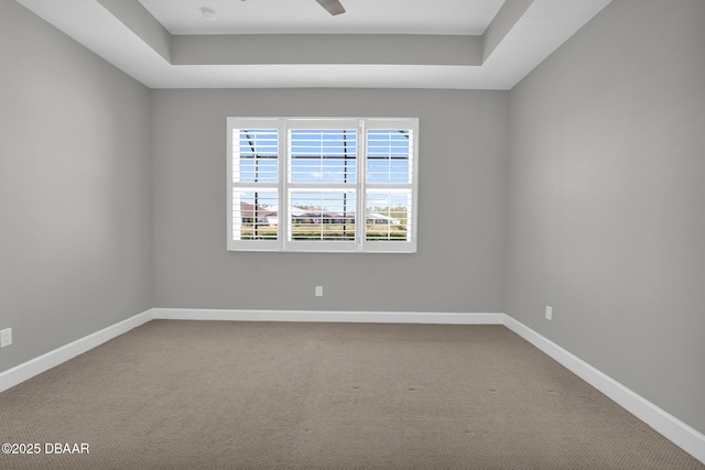 906 Coral Reef Way, Daytona Beach, FL 32124 - spare room featuring carpet flooring, a raised ceiling, and ceiling fan