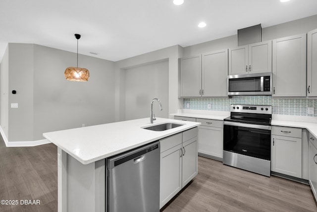 906 Coral Reef Way, Daytona Beach, FL 32124 - kitchen featuring appliances with stainless steel finishes, light countertops, backsplash, light wood-style floors, and recessed lighting