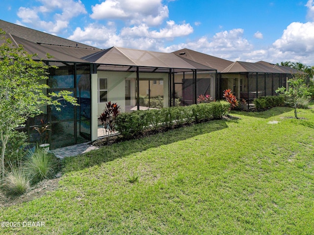 906 Coral Reef Way, Daytona Beach, FL 32124 - rear view of house featuring a lawn and a lanai