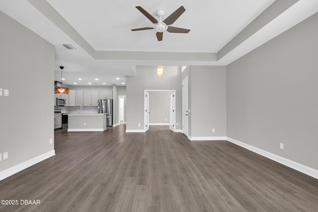 906 Coral Reef Way, Daytona Beach, FL 32124 - unfurnished living room with a ceiling fan, recessed lighting, and dark wood finished floors