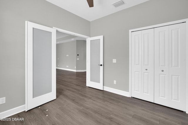 906 Coral Reef Way, Daytona Beach, FL 32124 - unfurnished bedroom featuring dark wood-type flooring, a closet, and ceiling fan