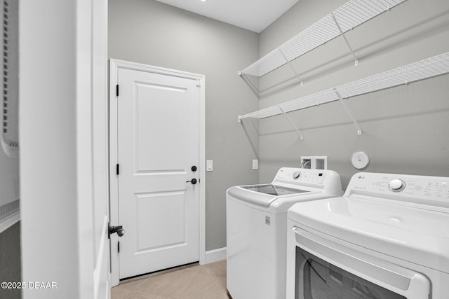 906 Coral Reef Way, Daytona Beach, FL 32124 - laundry area featuring washing machine and clothes dryer and light tile patterned floors