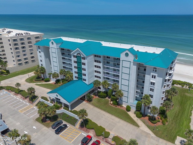 aerial view of apartment complex / building and a large body of water