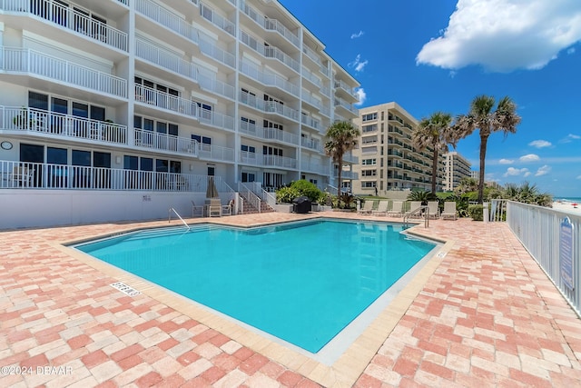 community pool featuring a patio area
