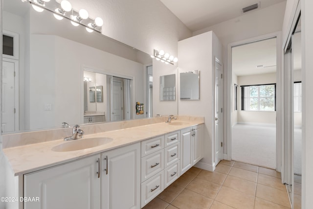 bathroom with vanity and tile patterned floors