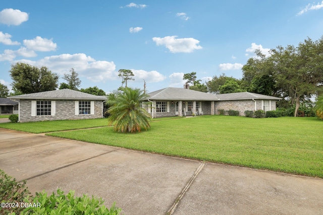 ranch-style home with a front yard