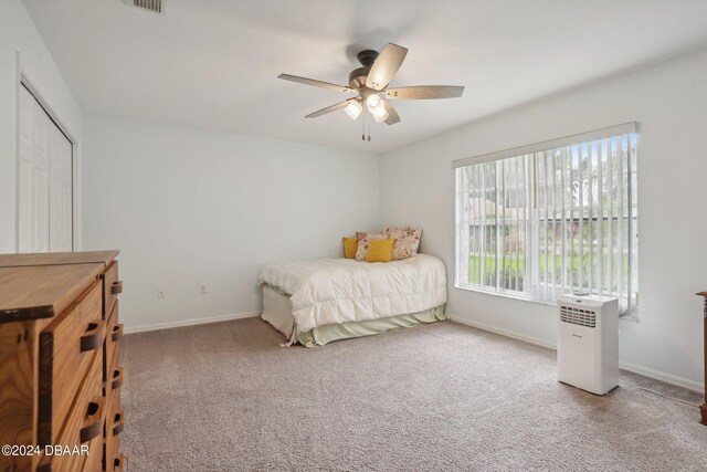 carpeted bedroom featuring ceiling fan