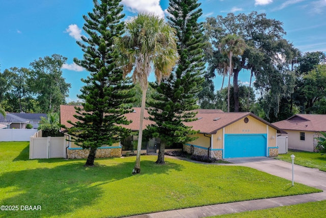 view of front facade with a garage and a front lawn