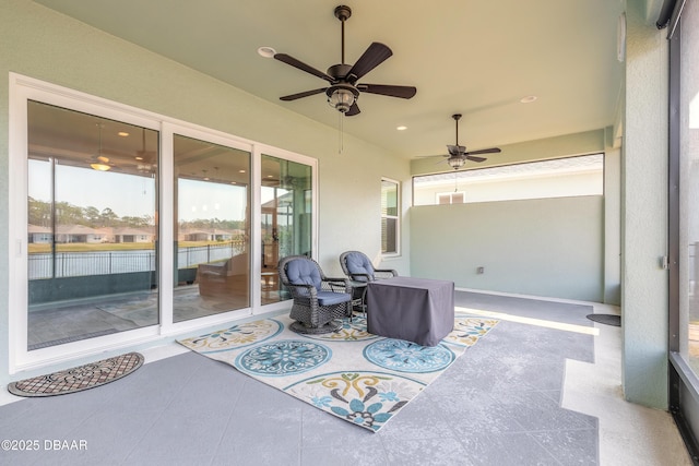 view of patio featuring ceiling fan