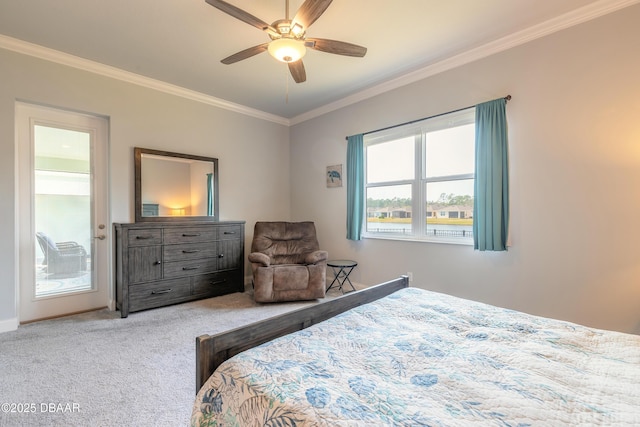 carpeted bedroom with access to outside, ornamental molding, and ceiling fan