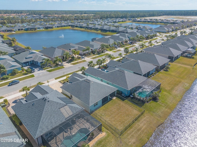 drone / aerial view with a water view