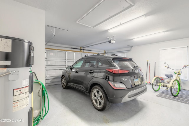 garage with a garage door opener and water heater